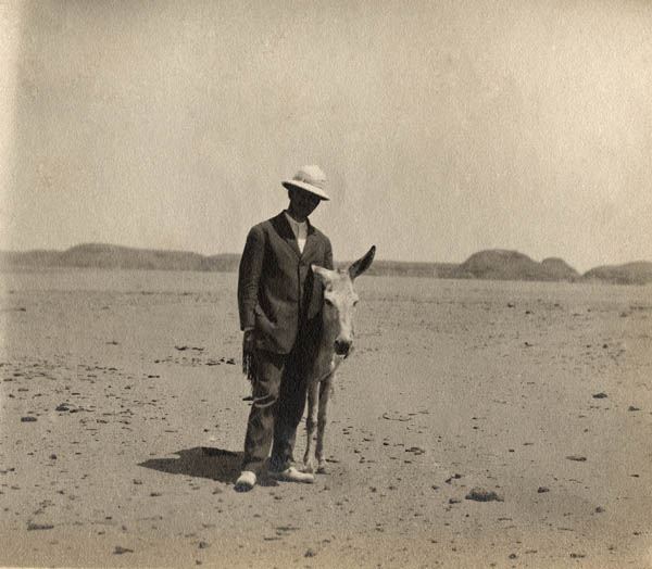 David Randall-MacIver with a donkey in Nubia, Egypt c. 1907. Penn Museum image #175378